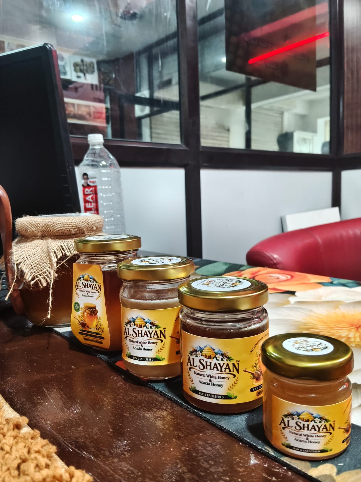 ALSHAYAN product workspace and honey jars
